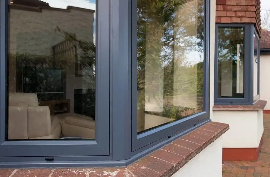 Sleek aluminium corner window installation highlighting modern Windows and Doors Hamilton craftsmanship by Double Glazing Hamilton.